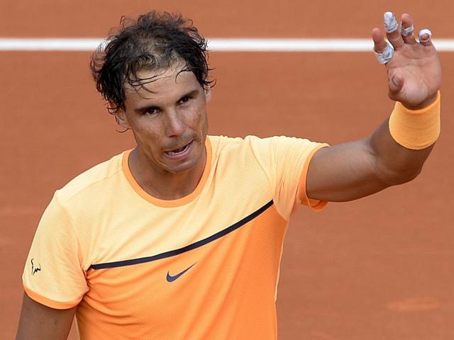 Spain's Rafael Nadal celebrates after beating compatriot Albert Montanes.(AFP)