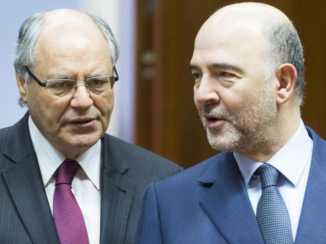 Malta's finance minister Edward Scicluna (L) and European commissioner for economic and financial affairs, taxation and customs Pierre Moscovici. (AFP file photo) Malta's finance minister Edward Scicluna (L) and European commissioner for economic and financial affairs, taxation and customs Pierre Moscovici. (AFP file photo)