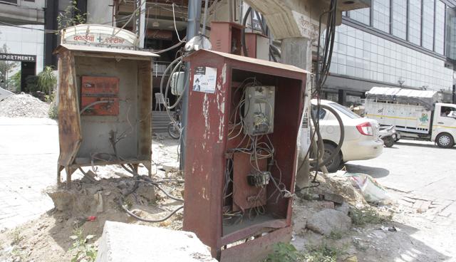 Naked wires in uncovered boxes near J Block traffic lights on Ferozepur Road in Ludhiana. (JS Grewal/HT)