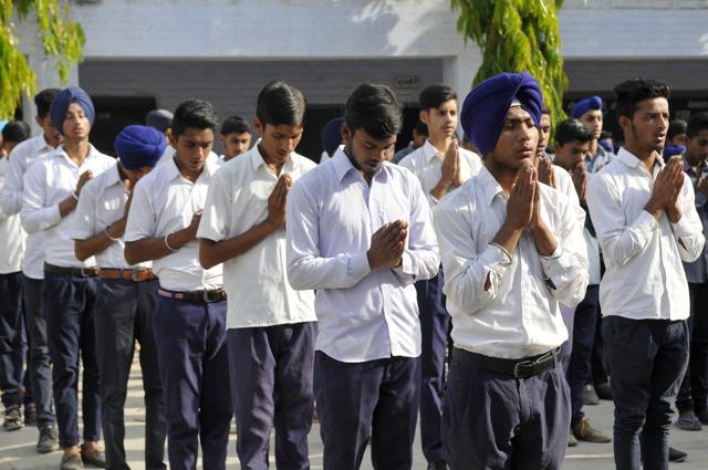 Students of Classes 11 and 12 at Government Senior Secondary School, Bajroor, in Rupnagar district, at the morning assembly, virtually praying that the school gets more lecturers. (Gurminder Singh/HT) Students of Classes 11 and 12 at Government Senior Secondary School, Bajroor, in Rupnagar district, at the morning assembly, virtually praying that the school gets more lecturers. (Gurminder Singh/HT)