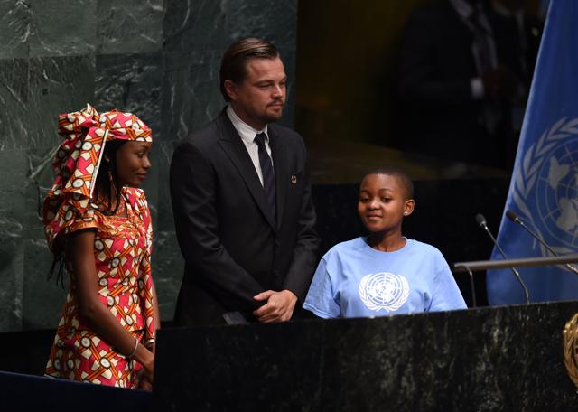 Hindou Oumarou Ibrahim, Coordinator of the Indigenous Women and Peoples Association of Chad, Getrude Clement(R), Youth Representative from Tanzania, and Leonardo DiCaprio. (AFP)