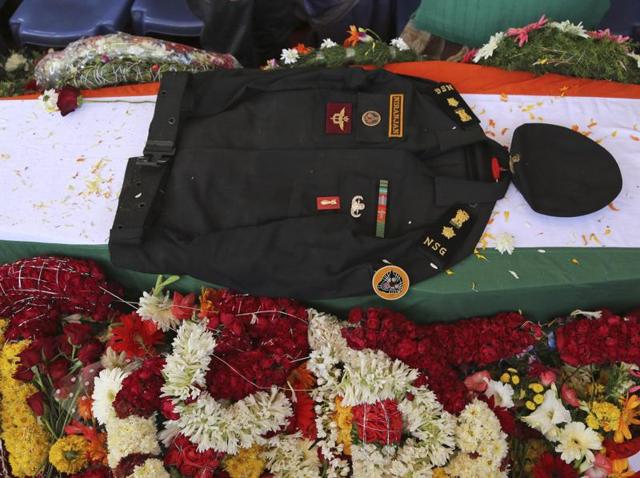 The uniform of India's National Security Guard commando Niranjan Kumar, who was among those killed in the attack on the Pathankot air force base is placed on his coffin draped in an Indian flag, in Bangalore, India. (AP Photo) The uniform of India's National Security Guard commando Niranjan Kumar, who was among those killed in the attack on the Pathankot air force base is placed on his coffin draped in an Indian flag, in Bangalore, India. (AP Photo)