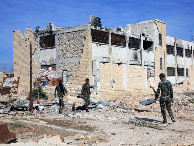 This file photo released by the Syrian official news agency SANA shows Syrian government troops walk inside the Kweiras air base, east of Aleppo. (AP) This file photo released by the Syrian official news agency SANA shows Syrian government troops walk inside the Kweiras air base, east of Aleppo. (AP)