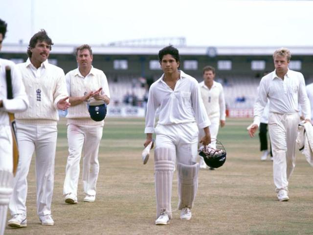 A young Sachin is applauded by England players as he walks off the field after a Test match. (Getty Images)