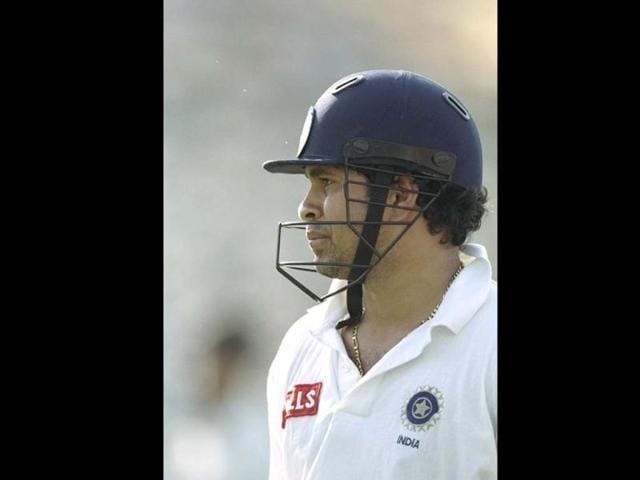 Sachin during a Test match against Australia. The Master Blaster rarely plays without the headgear, even against spinners, since he was pushed up the order in the '90s. Clive Mason/Allsport. Getty Images.