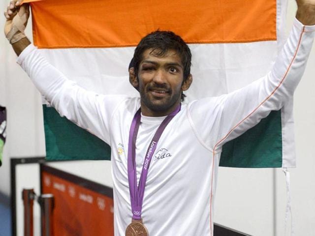 In this file photo, Yogeshwar Dutt celebrates after winning the bronze medal in the men’s 60-kg freestyle wrestling competition at the 2012 Olympics.(PTI)