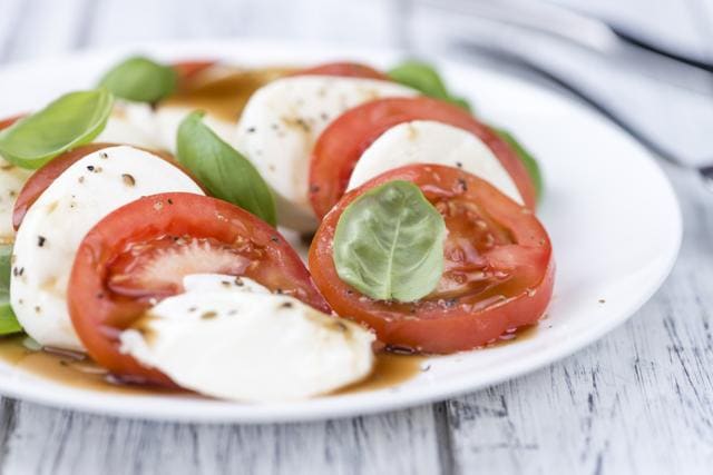 Mozzarella cheese and tomatoes in balsamic vinegar is a popular appetizer. (Shutterstock)