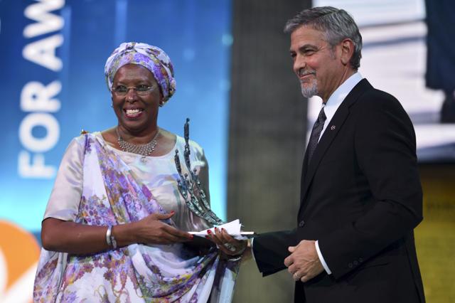 US Actor George Clooney, right, presents the first Aurora Prize, an award recognizing an individual's work to advance humanitarian causes, to Marguerite Barankitse, left, during an awarding ceremony in Yerevan, Armenia. (AP) US Actor George Clooney, right, presents the first Aurora Prize, an award recognizing an individual's work to advance humanitarian causes, to Marguerite Barankitse, left, during an awarding ceremony in Yerevan, Armenia. (AP)