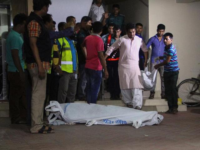 The bodies of two gay rights activists who were hacked to death are brought down from an apartment in Dhaka on April 25, 2016. (AFP) The bodies of two gay rights activists who were hacked to death are brought down from an apartment in Dhaka on April 25, 2016. (AFP)