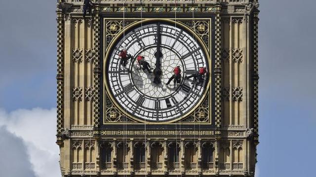 Cleaners abseil down one of the faces of Big Ben, to clean and polish the clock face, above the Houses of Parliament, in central London August 19, 2014. (Reuters) Cleaners abseil down one of the faces of Big Ben, to clean and polish the clock face, above the Houses of Parliament, in central London August 19, 2014. (Reuters)