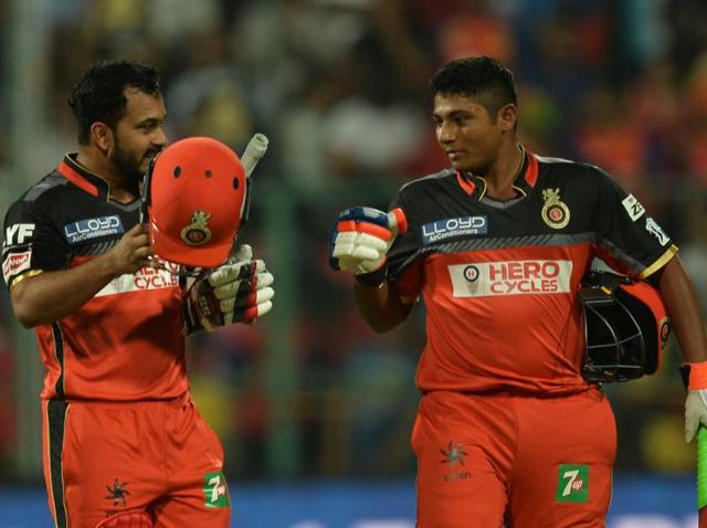 Royal Challengers Bangalore batsman Sarfaraz Khan (right) congratulates Kedar Jadhav after the end of the first innings againstSunrisers Hyderabad at the M Chinnaswamy Stadium in Bangalore. (AFP) Royal Challengers Bangalore batsman Sarfaraz Khan (right) congratulates Kedar Jadhav after the end of the first innings againstSunrisers Hyderabad at the M Chinnaswamy Stadium in Bangalore. (AFP)