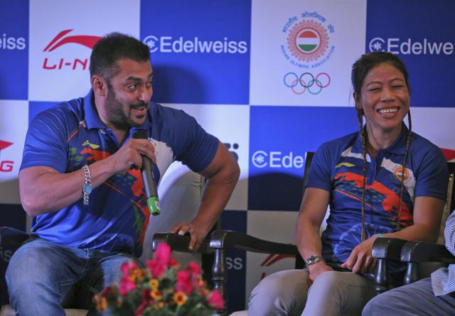 Indian boxer Mary Kom, right, looks away shyly as Bollywood actor Salman Khan speaks about her at an event to announce Khan as the goodwill ambassador for Rio Olympics 2016 in New Delhi on Saturday. (AP)