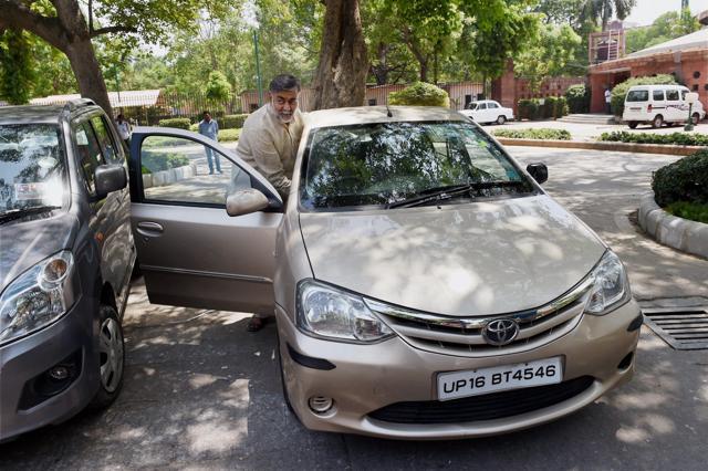 BJP MP Prahlad Singh Patel leaves in his even-numbered car in violation of the the odd-even scheme. (PTI Photo)