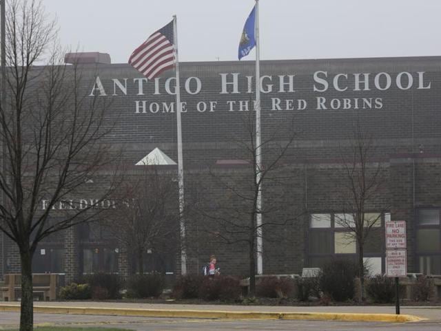 A student crosses below two flags while entering Antigo High School, Monday, April 25, 2016, in Antigo, Wis. (AP) A student crosses below two flags while entering Antigo High School, Monday, April 25, 2016, in Antigo, Wis. (AP)