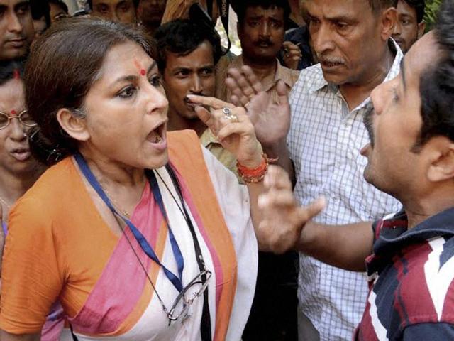 BJP Candidate Roopa Ganguly in arguments with an activist of a rival political party at a polling booth in Howrah on Monday. (PTI Photo) BJP Candidate Roopa Ganguly in arguments with an activist of a rival political party at a polling booth in Howrah on Monday. (PTI Photo)