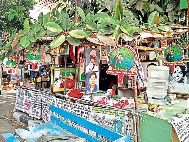 A stall outside AIADMK office sells Jayalalithaa and MGR merchandise to woo voters.(HT Photo)