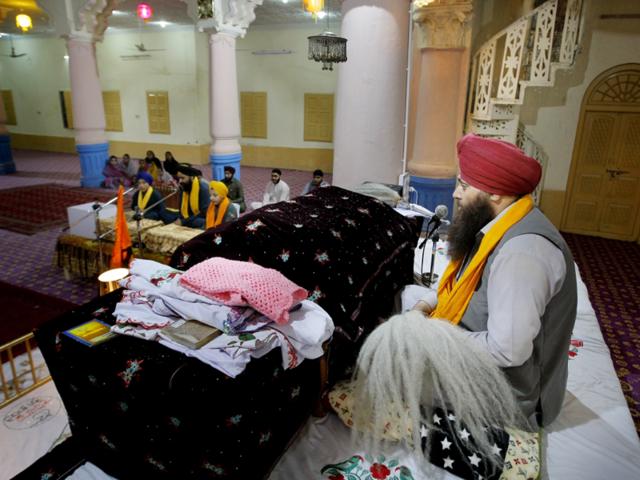 In this Sunday, April 24 photo, a Pakistani Sikh priest leads prayers at the 300-year-old gurdwara in Peshawar. (AP Photo) In this Sunday, April 24 photo, a Pakistani Sikh priest leads prayers at the 300-year-old gurdwara in Peshawar. (AP Photo)