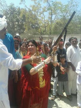 Images of women wearing bullet belts and carrying a double-barrelled shotgun at a religious celebration were widely shared. (Jayesh Ravrani/HT Photo) Images of women wearing bullet belts and carrying a double-barrelled shotgun at a religious celebration were widely shared. (Jayesh Ravrani/HT Photo)
