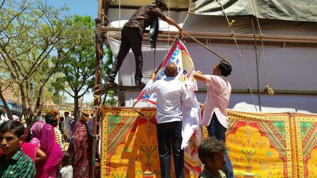 As the villagers protested, the organisers quickly removed the signs. (HT Photo) As the villagers protested, the organisers quickly removed the signs. (HT Photo)