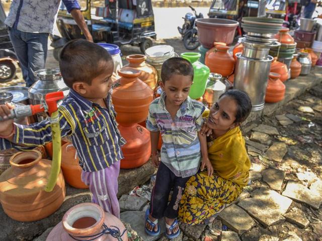 The lack of water has transformed the work day completely. Each day, women and children have to abandon all their work to queue up for five to six long hours to fetch water. (Satish Bate/Hindustan Times)