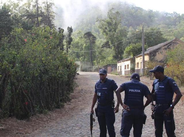 Police stand guard on the road leading to the Spanish embassye. A disgruntled soldier is suspected of gunning down eight other soldiers and three civilians Tuesday at a military barracks in Cape Verde (REUTERS) Police stand guard on the road leading to the Spanish embassye. A disgruntled soldier is suspected of gunning down eight other soldiers and three civilians Tuesday at a military barracks in Cape Verde (REUTERS)