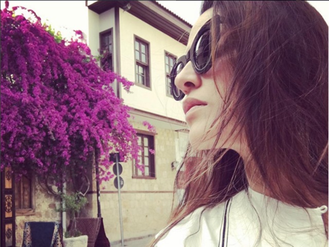 Neha Dhupia gets clicked on a Turkey street with bougainvillea in full bloom in the background.  (Instagram) 