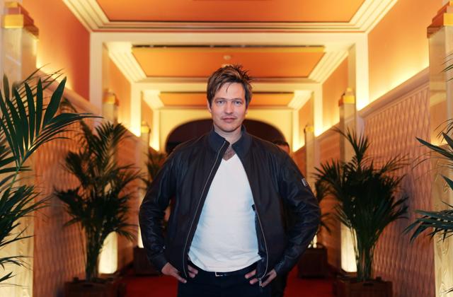 Thomas Vinterberg poses in a palace hotel in Cannes. (AFP)