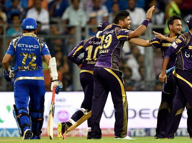 Kolkata Knight Riders bowler Umesh Yadav celebrates with teammates the wicket of Mumbai Indians’ Parthiv Patel. (PTI) 