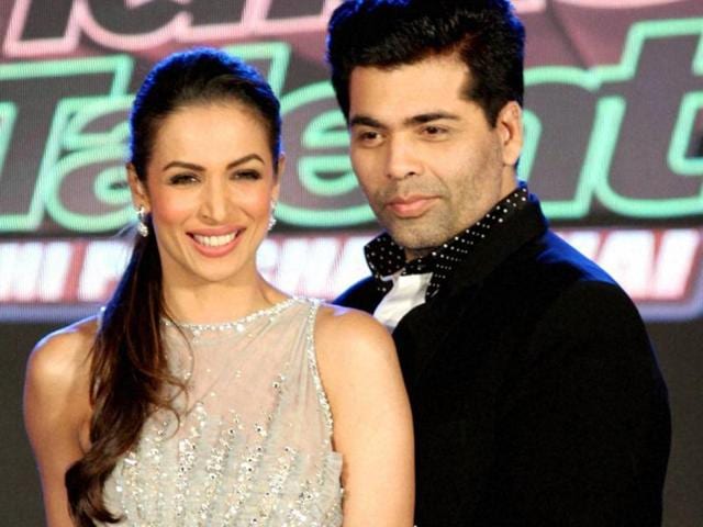 Filmmaker Karan Johar and actor Malaika Arora at the launch of a TV Show in Mumbai on Wednesday. (PTI)