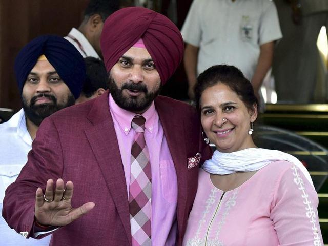 Newly nominated Rajya Sabha MP Navjot Singh Sidhu with his wife Navjot Kaur Sidhu coming out of parliament in New Delhi on Thursday.(PTI) Newly nominated Rajya Sabha MP Navjot Singh Sidhu with his wife Navjot Kaur Sidhu coming out of parliament in New Delhi on Thursday.(PTI)