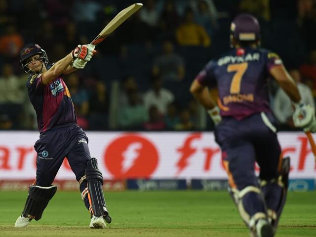 Steven Smith hits a shot as Dhoni runs in for a single. (AFP) Steven Smith hits a shot as Dhoni runs in for a single. (AFP)