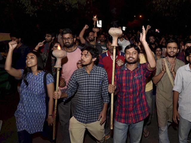 JNUSU President Kanhaiya Kumar with Umar Khalid and other students carried torch parade at JNU campus in New Delhi on Wednesday. (PTI) JNUSU President Kanhaiya Kumar with Umar Khalid and other students carried torch parade at JNU campus in New Delhi on Wednesday. (PTI)