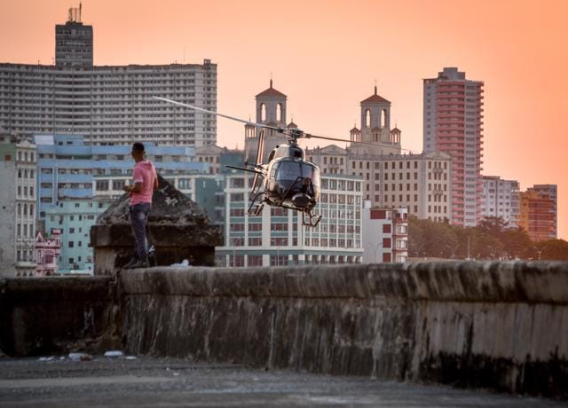 Cubans look on at one of the helicopters from Universal Studios during the shooting of Fast & Furious 8 in Havana. (AFP) Cubans look on at one of the helicopters from Universal Studios during the shooting of Fast & Furious 8 in Havana. (AFP)