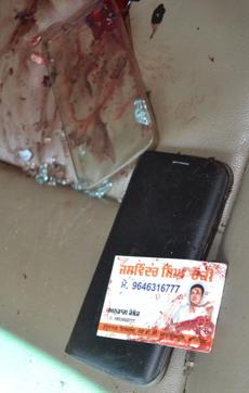 A bloodstained visiting card of slain gangster-politician Jaswinder Singh ‘Rocky A bloodstained visiting card of slain gangster-politician Jaswinder Singh ‘Rocky