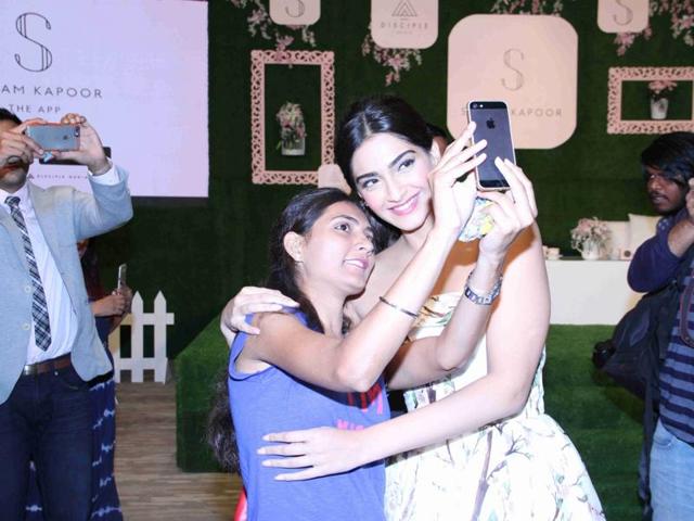 Sonam Kapoor clicks a selfie with a fan during a press conference organised to announce launch of her mobile application. (IANS) 