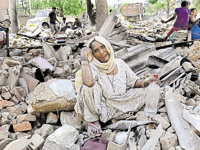 A disgruntled Sita Devi, who says she has not been allotted a flat by the UT, at the Lal Bahadur Shastri Colony, Sector 56, on Friday.(Gurminder Singh/HT Photo)