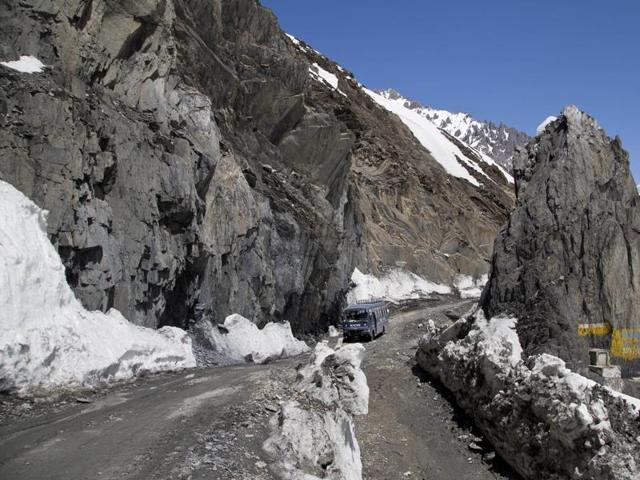 An Indian army vehicle drives through the Zojila Pass, which was closed since December 29 owing to heavy snowfall during winter. (AP) An Indian army vehicle drives through the Zojila Pass, which was closed since December 29 owing to heavy snowfall during winter. (AP)