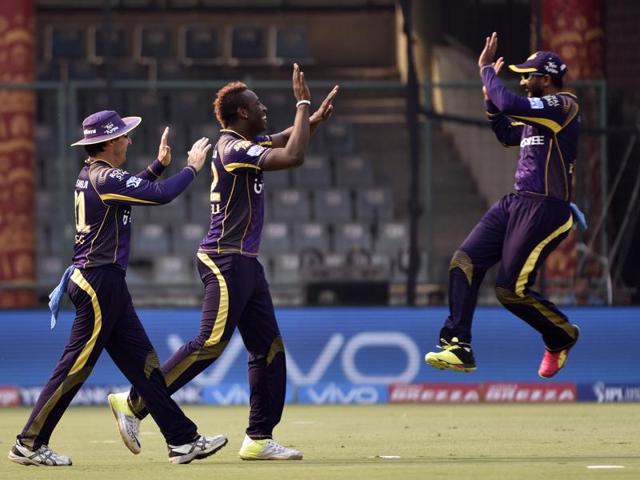 Kolkata bowler Andre Russell, centre, celebrates with team members after the dismissal of Quinton De Kock. (Virendra Singh Gosain/HT Photo)