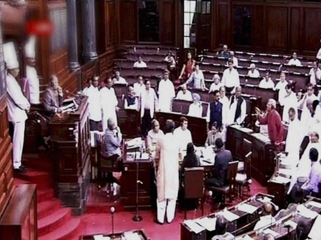 Members protest in the well of the Rajya Sabha in New Delhi on Friday. (PTI Photo) Members protest in the well of the Rajya Sabha in New Delhi on Friday. (PTI Photo)