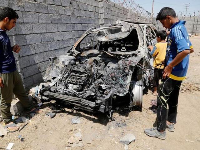 People gather at the site of a suicide bomb attack in a southeastern suburb of Baghdad, Iraq on Saturday (Reuters) People gather at the site of a suicide bomb attack in a southeastern suburb of Baghdad, Iraq on Saturday (Reuters)