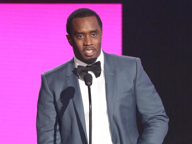 Sean Diddy Combs presents the award for best collaboration of the year at the American Music Awards in Los Angeles.(Matt Sayles/Invision/AP)