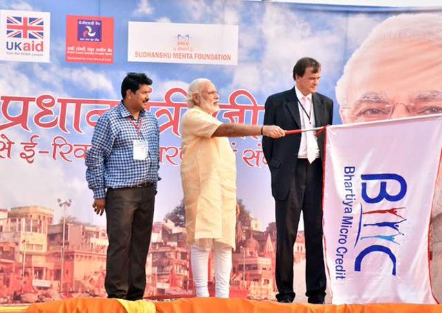 Modi flagged off the distribution of e-rickshaws and took a ride on a vehicle at the DLW ground. (Photo: PIB/Twitter) Modi flagged off the distribution of e-rickshaws and took a ride on a vehicle at the DLW ground. (Photo: PIB/Twitter)