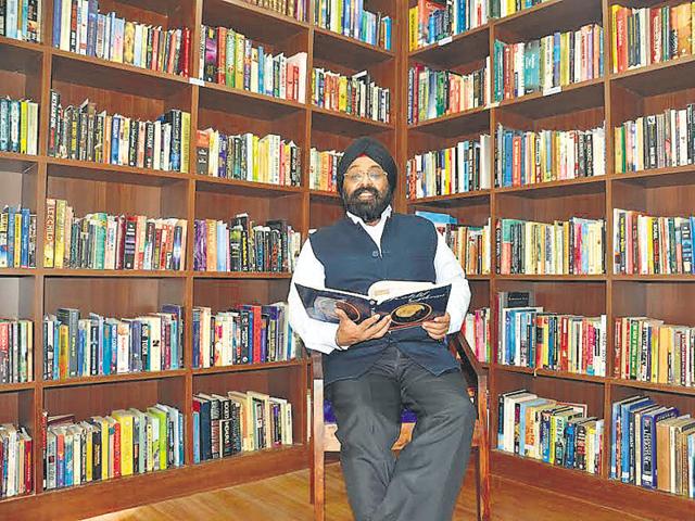 Paramjeet Singh in his massive library. (HT Photo) Paramjeet Singh in his massive library. (HT Photo)
