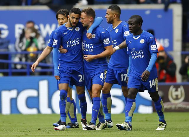 Riyad Mahrez celebrates with team mates after scoring the first goal for Leicester against Swansea City. (Reuters Photo)