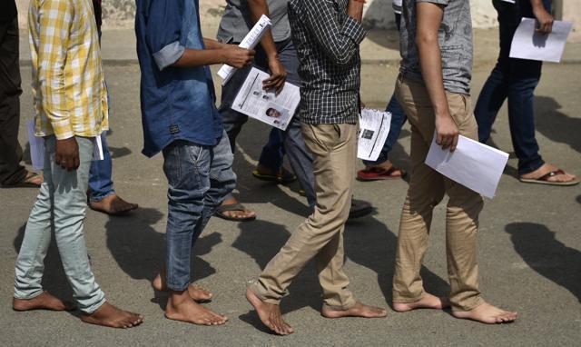 Candidates were made to go barefoot for scanning before the NEET 1 examination commenced, at RK Puram exam centre, New Delhi. (Vipin Kumar/HT Photo) Candidates were made to go barefoot for scanning before the NEET 1 examination commenced, at RK Puram exam centre, New Delhi. (Vipin Kumar/HT Photo)