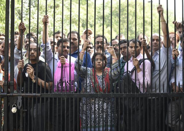 Students and parents stand outside the gate before the NEET 1 examination commenced, in RK Puram, New Delhi. (Vipin Kumar/HT Photo) Students and parents stand outside the gate before the NEET 1 examination commenced, in RK Puram, New Delhi. (Vipin Kumar/HT Photo)