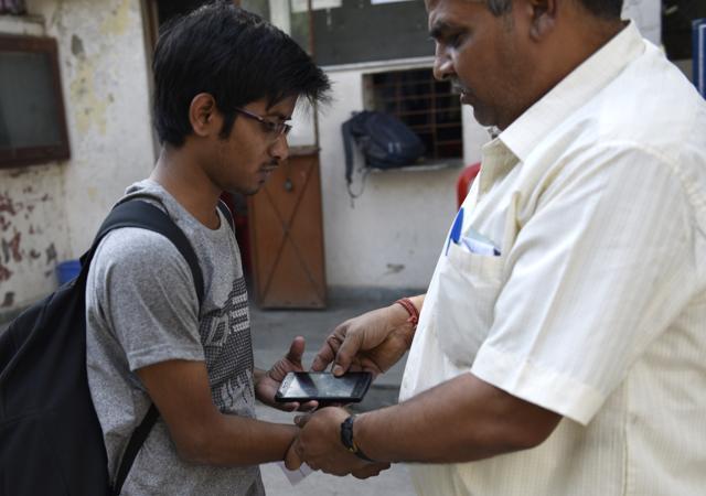 Aspirants were not allowed to carry mobile phones or any digital device inside the examination centre, in RK Puram, New Delhi. (Vipin Kumar/HT Photo) Aspirants were not allowed to carry mobile phones or any digital device inside the examination centre, in RK Puram, New Delhi. (Vipin Kumar/HT Photo)
