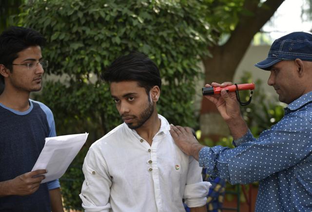 Students were thoroughly scanned at the entrance at a centre in New Delhi. (Vipin Kumar/HT) Students were thoroughly scanned at the entrance at a centre in New Delhi. (Vipin Kumar/HT)