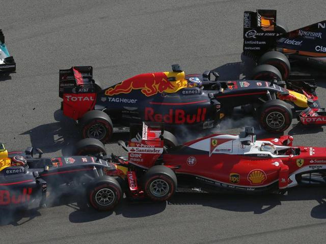 Ferrari driver Sebastian Vettel of Germany, right, is pushed by Russia’s Red Bull driver Daniil Kvyat, left, while Australian Red Bull driver Daniel Ricciardo and Force India driver Sergio Perez of Mexico, rear right, pass by during the Russian Grand Prix. (AP) Ferrari driver Sebastian Vettel of Germany, right, is pushed by Russia’s Red Bull driver Daniil Kvyat, left, while Australian Red Bull driver Daniel Ricciardo and Force India driver Sergio Perez of Mexico, rear right, pass by during the Russian Grand Prix. (AP)