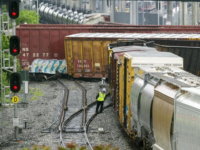 An emergency services employee works at the scene of train derailment in Washington. (AP) An emergency services employee works at the scene of train derailment in Washington. (AP)